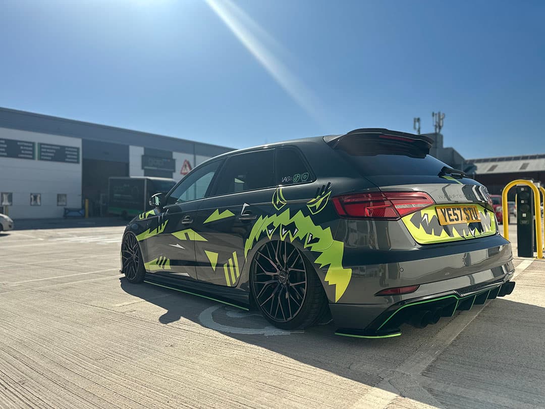 Stuart Hammond’s 2016 Audi A3 S line Sportback 2.0L TDI, with a custom wrap of acid yellow, black, and white decals created by Wraptor Customs