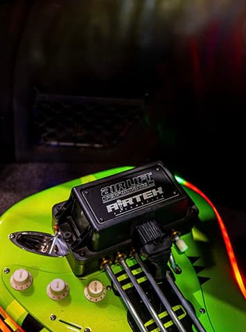 Stuart Hammond’s 2016 Audi A3 S line Sportback 2.0L TDI with Air Lift Performance 3P and a built-in fully functional Line6 guitar amp, and hardline pipes positioned to look like guitar strings.